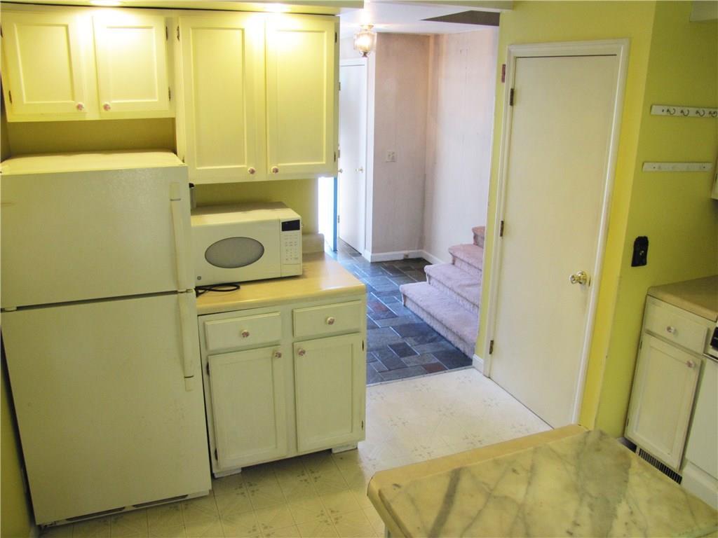 1193 Sunshine Road Deer Isle, ME 04627 - Photo 8 of 23 Kitchen, with entrance door coming...