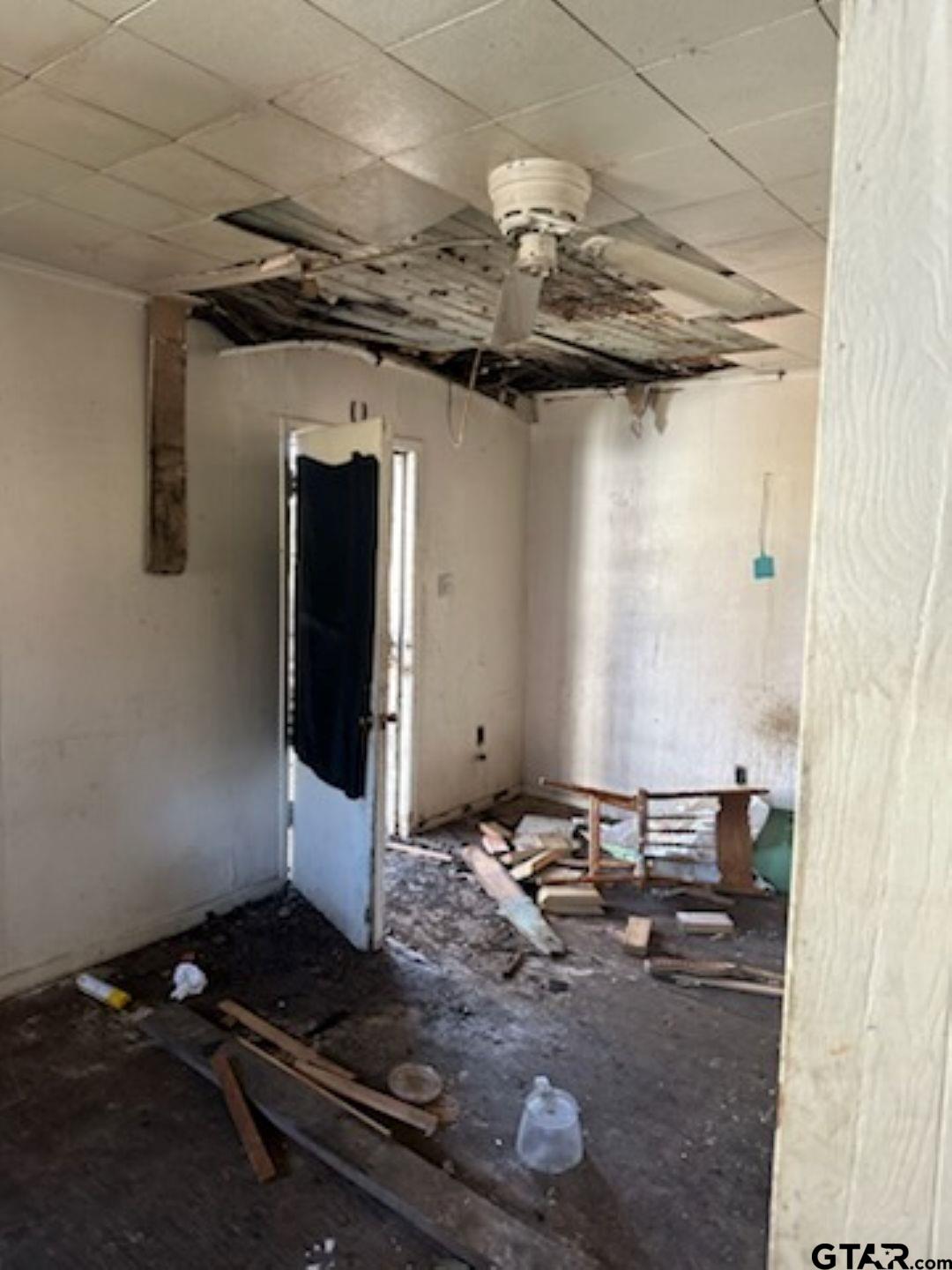 1510 Ray Street Longview, TX 75602 - Photo 4 of 6 a bathroom with a granite countertop sink and a mirror