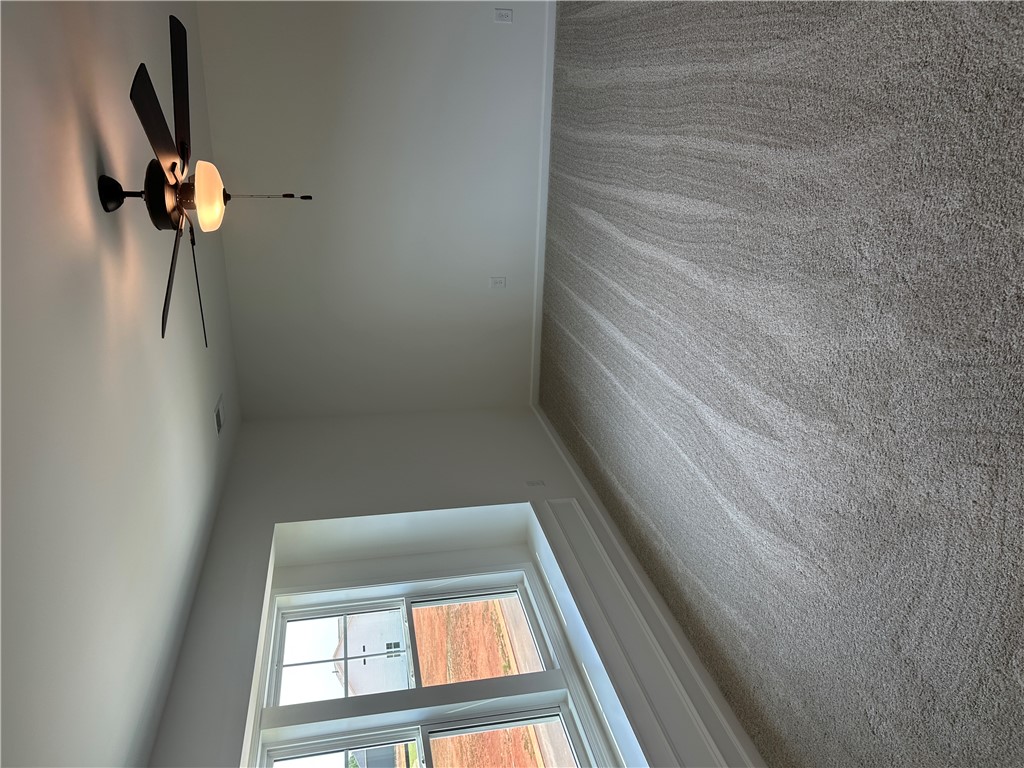 202 Bellflower Lane Pendleton, SC 29670 - Photo 18 of 27 Plush carpeting and well-lit interiors define this welcoming living space.