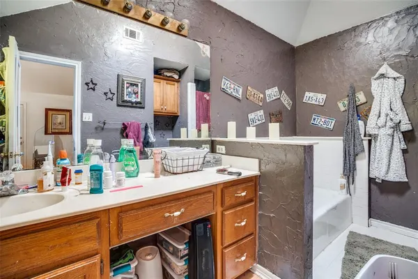 a bathroom with a sink double vanity and a mirror