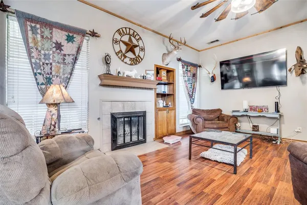 a living room with furniture and a flat screen tv