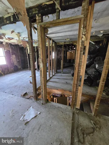 a living room with chairs and a table