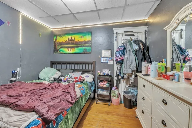 a bedroom with a bed and a walk in closet