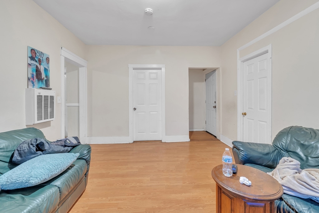 215 Beacon Street Worcester, MA 01610 - Photo 19 of 24 a living room with furniture and a couch