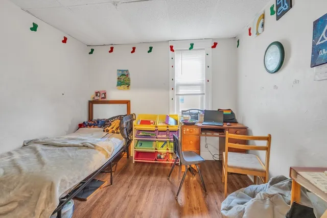 a bedroom with a bed and a table in it