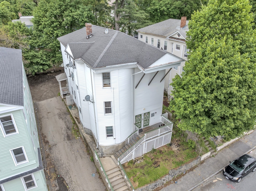 215 Beacon Street Worcester, MA 01610 - Photo 2 of 24 a aerial view of a house with a yard
