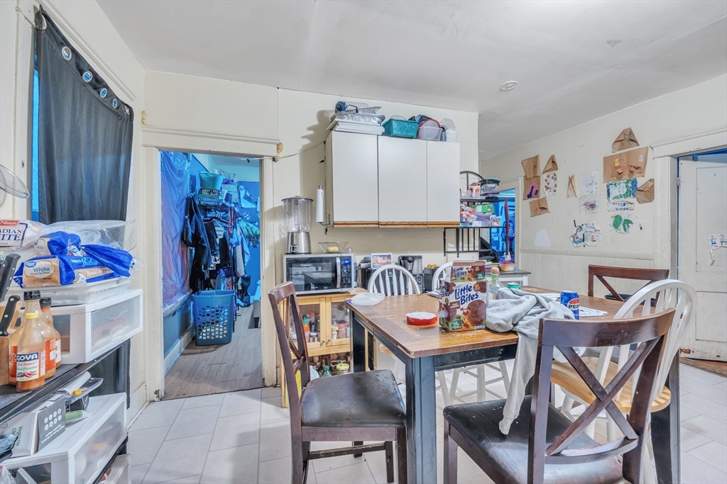 215 Beacon Street Worcester, MA 01610 - Photo 4 of 24 a view of a dining room with furniture and a kitchen