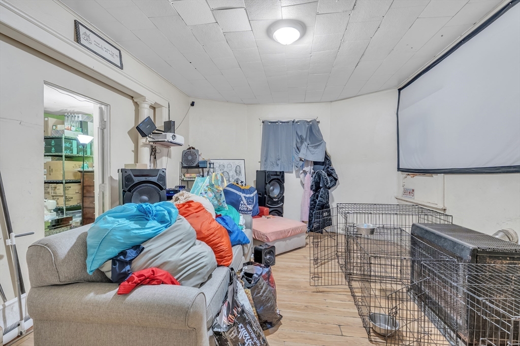 215 Beacon Street Worcester, MA 01610 - Photo 5 of 24 a living room with furniture and a fireplace