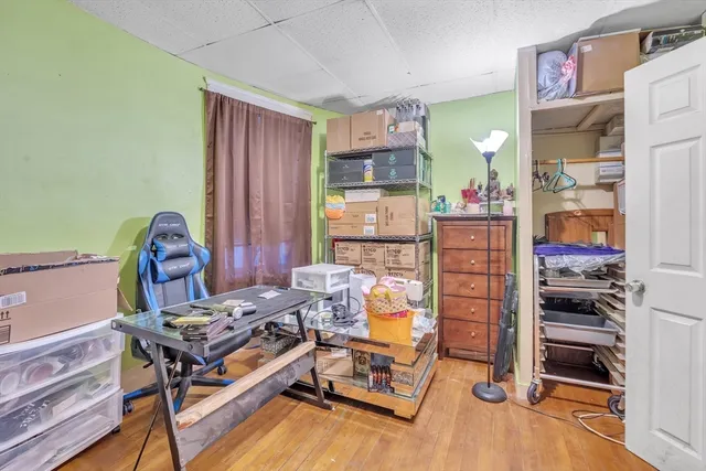 a bedroom with furniture and a window