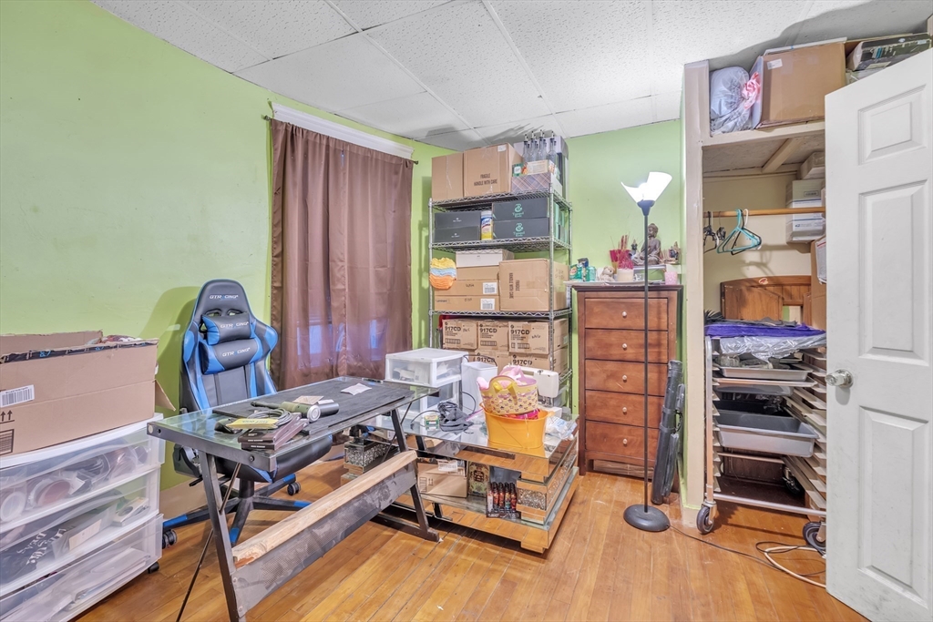 215 Beacon Street Worcester, MA 01610 - Photo 7 of 24 a bedroom with furniture and a window