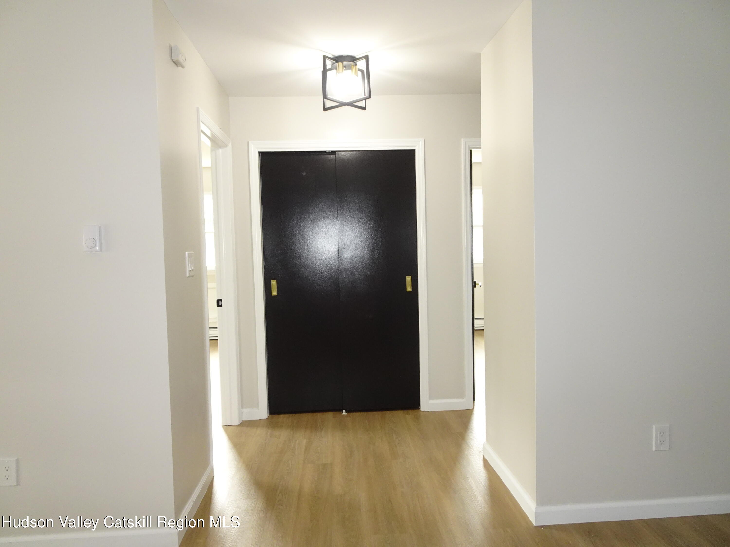 167 Highway 23, Unit 1C Claverack-Red Mills, NY 12513 - Photo 14 of 18 a view of hallway with wooden floor