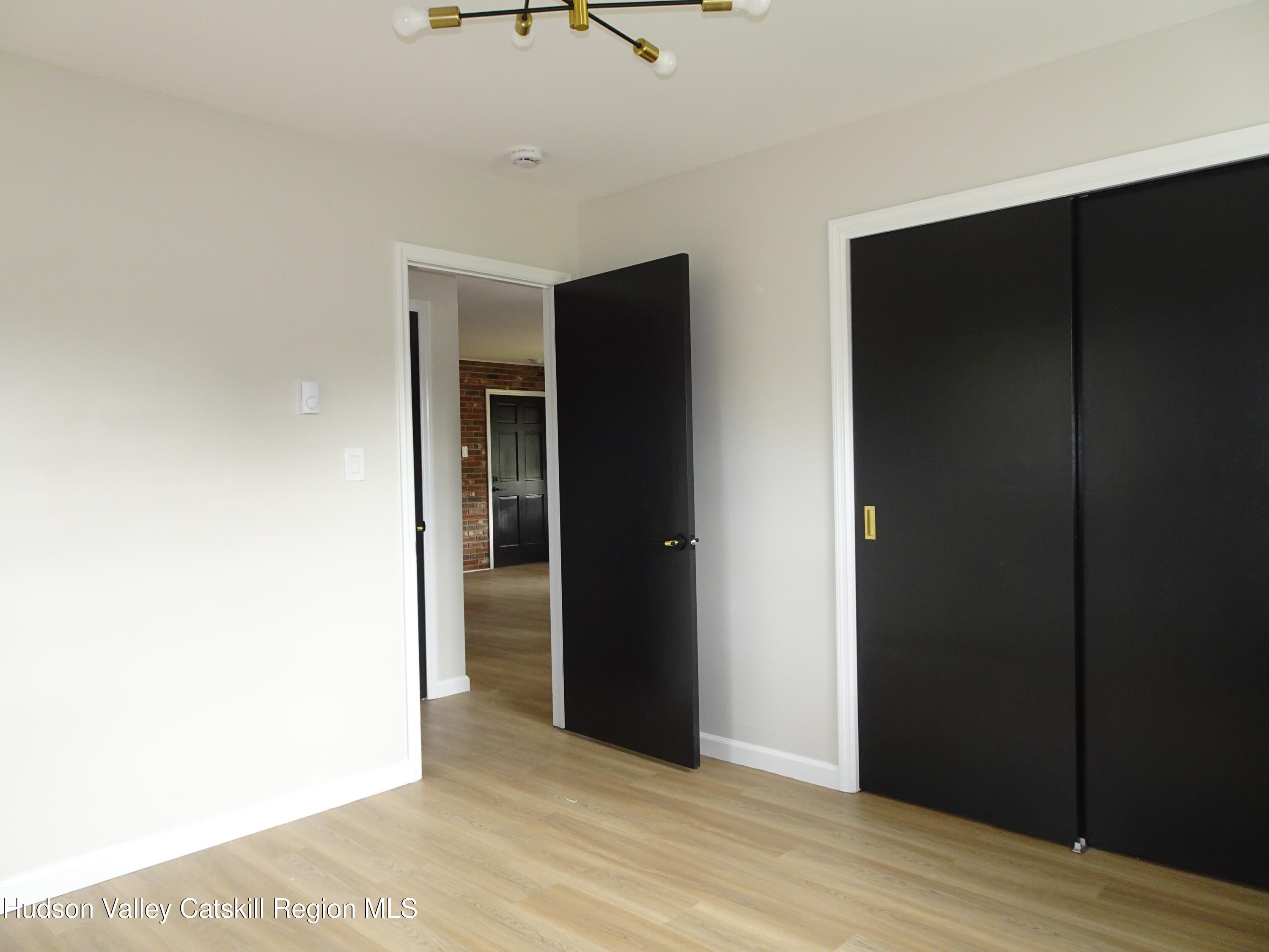 167 Highway 23, Unit 1C Claverack-Red Mills, NY 12513 - Photo 16 of 18 a view of an empty room with wooden floor