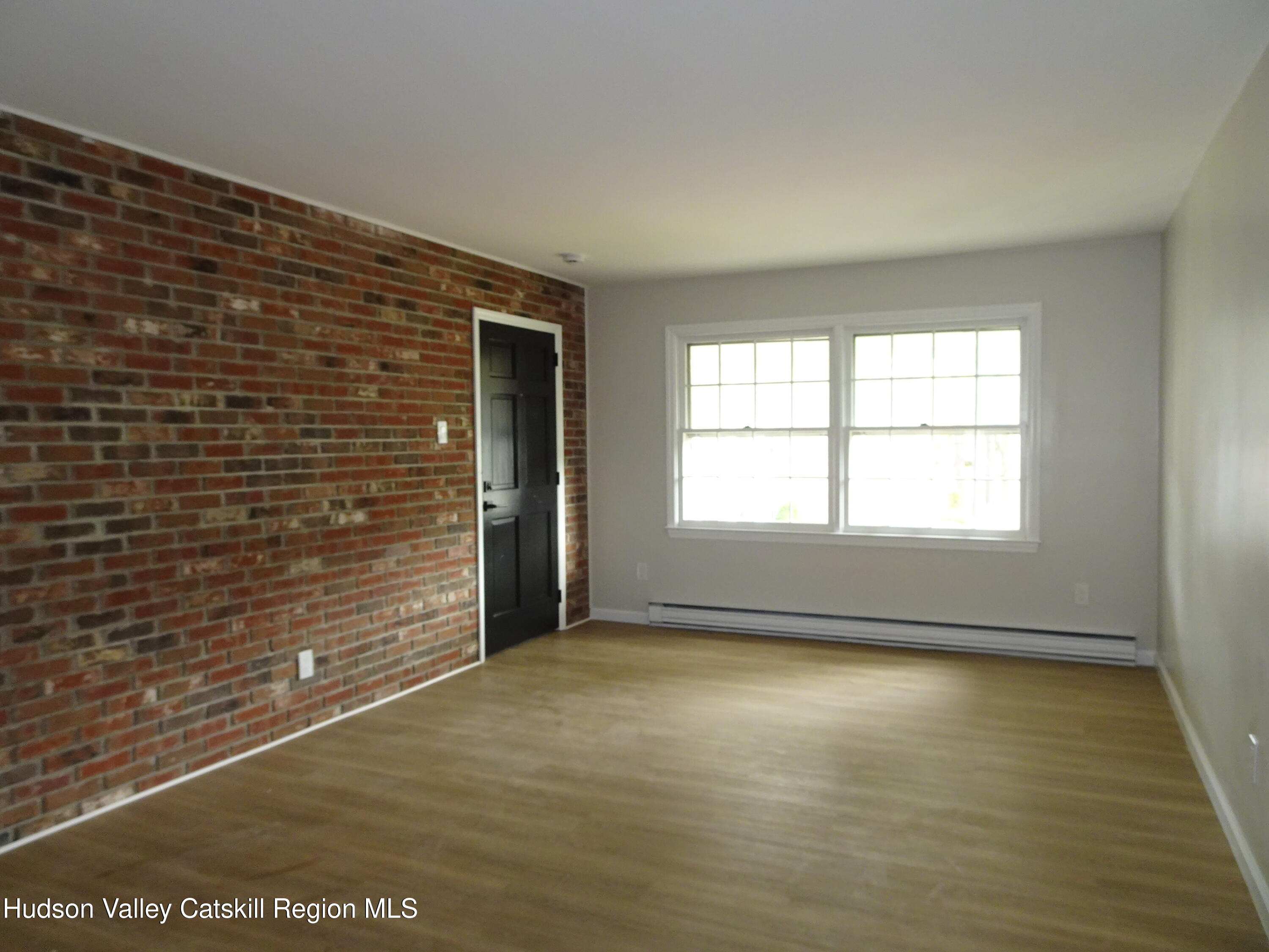 167 Highway 23, Unit 1C Claverack-Red Mills, NY 12513 - Photo 6 of 18 a view of an empty room with a window
