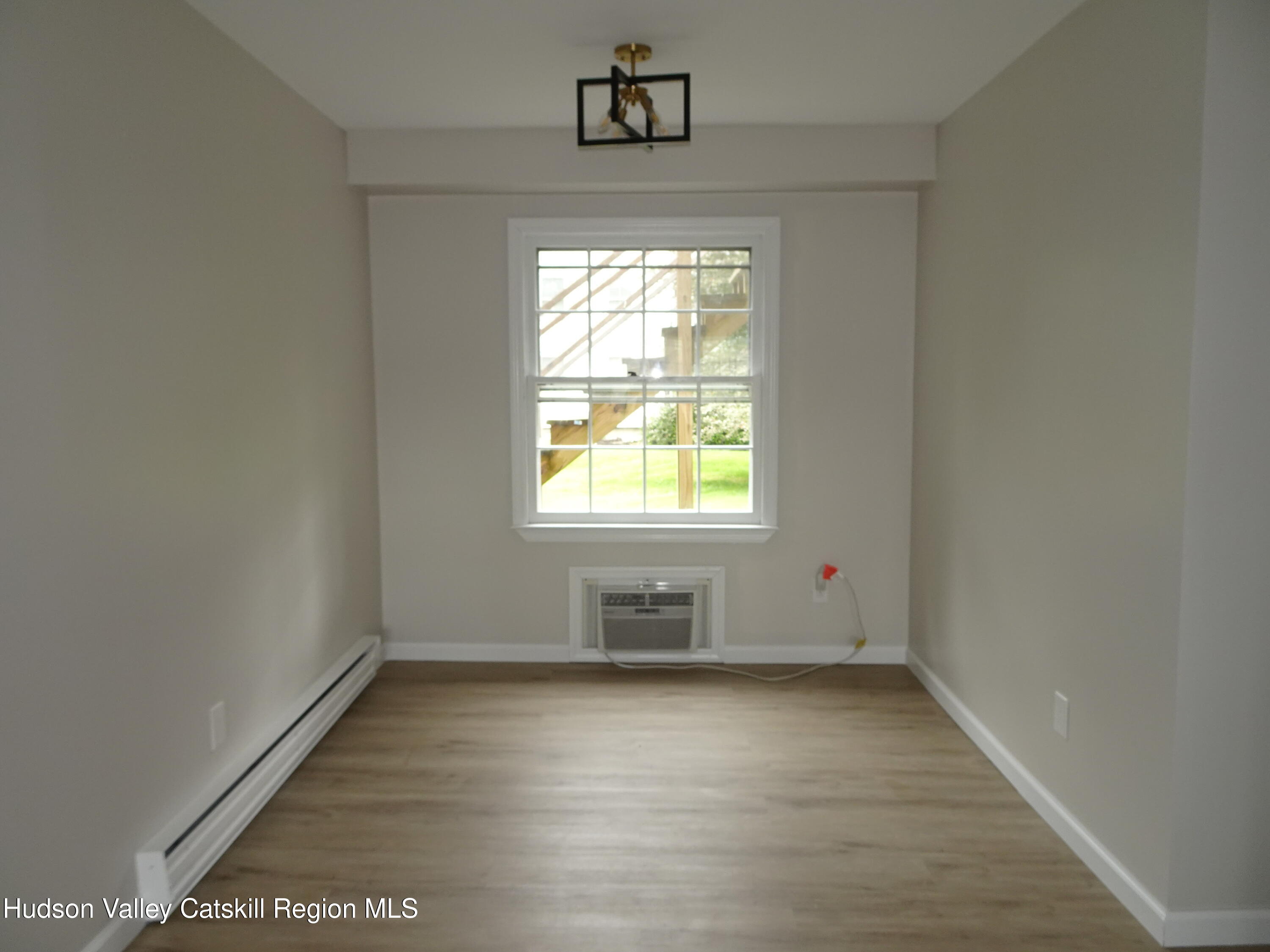 167 Highway 23, Unit 1C Claverack-Red Mills, NY 12513 - Photo 9 of 18 an empty room with a window