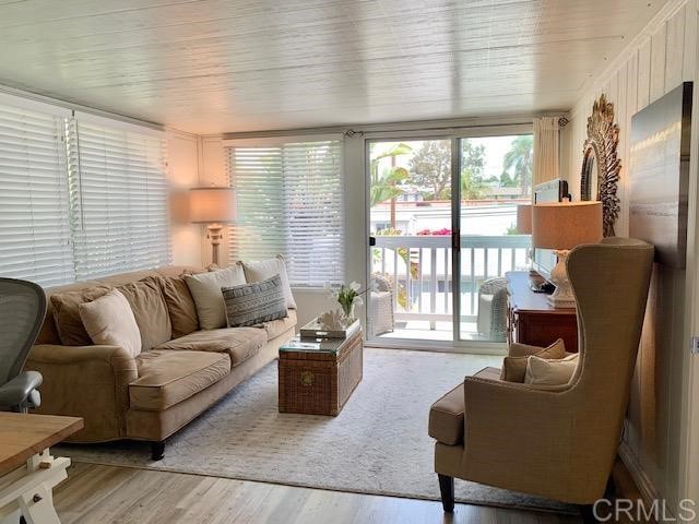 123 Jasper Street, Unit 23 Encinitas, CA 92024 - Photo 16 of 23 a living room with furniture and a large window