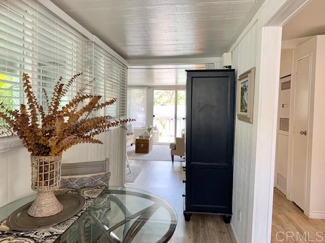 123 Jasper Street, Unit 23 Encinitas, CA 92024 - Photo 7 of 23 a living room with furniture and a chandelier