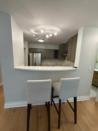 a kitchen with stainless steel appliances granite countertop a sink and stove top oven