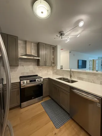 a view of a room with a kitchen