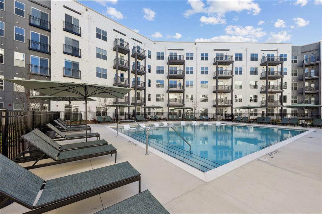 2945 Cumberland Mall, Unit T1032 Atlanta, GA 30339 - Photo 19 of 31 a view of a swimming pool with outdoor seating