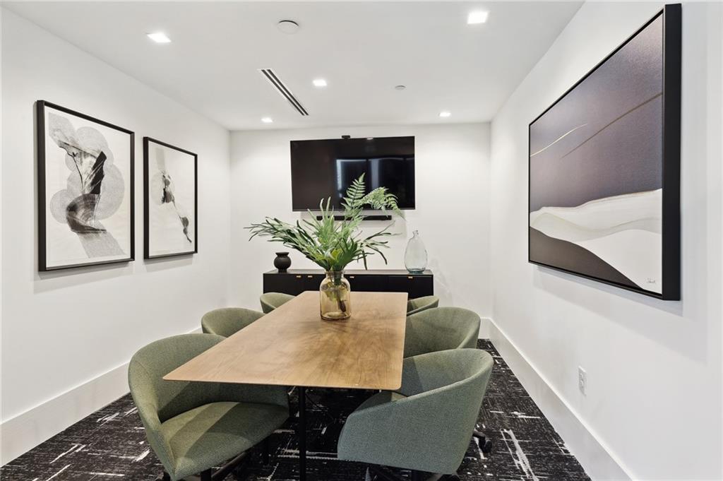 2945 Cumberland Mall, Unit T1032 Atlanta, GA 30339 - Photo 31 of 31 a view of a dining room with furniture and wooden floor