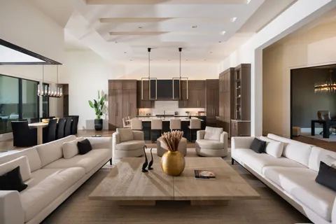 a large bathroom with a tub sink shower and mirror