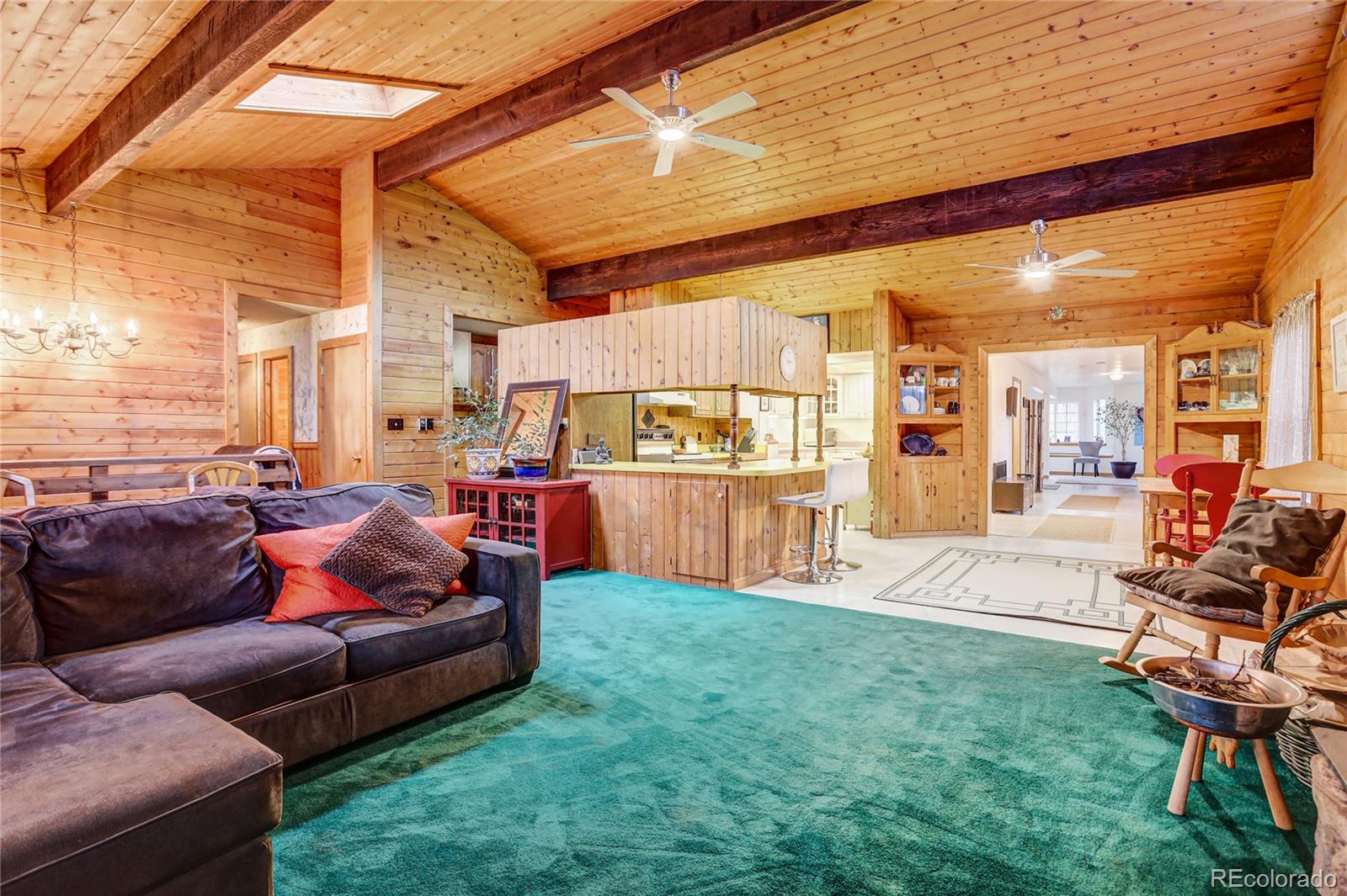 25 Granada Way Pine, CO 80470 - Photo 17 of 40 a outdoor living space with furniture and a yard