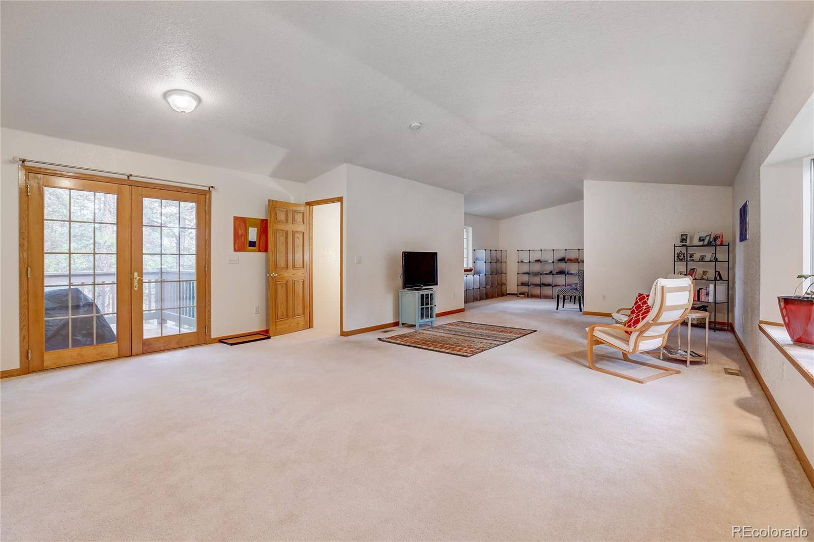 25 Granada Way Pine, CO 80470 - Photo 18 of 40 a view of a livingroom with furniture and a livingroom