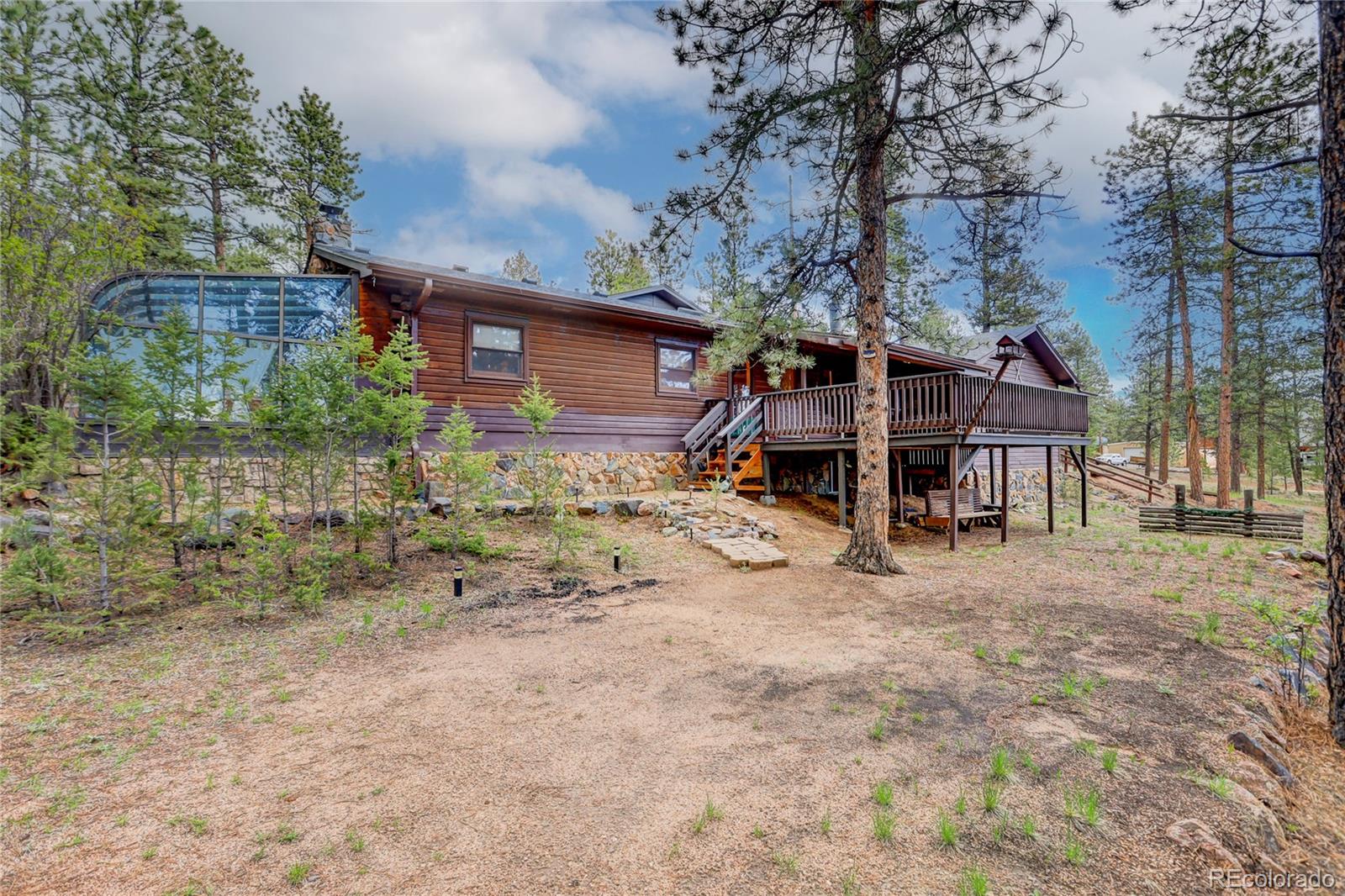 25 Granada Way Pine, CO 80470 - Photo 35 of 40 a view of a house with a yard