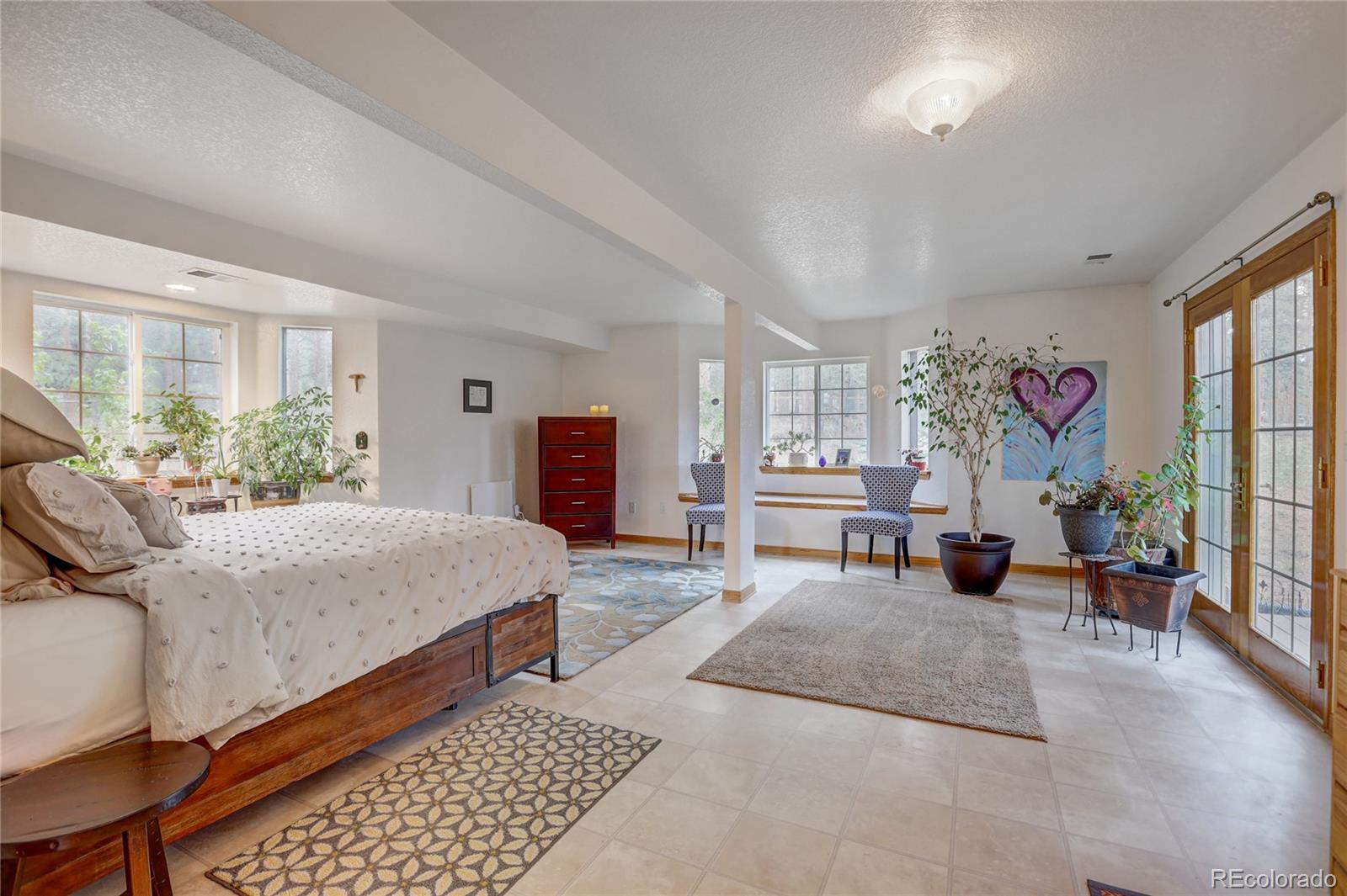 25 Granada Way Pine, CO 80470 - Photo 7 of 40 a living room with furniture and a large window