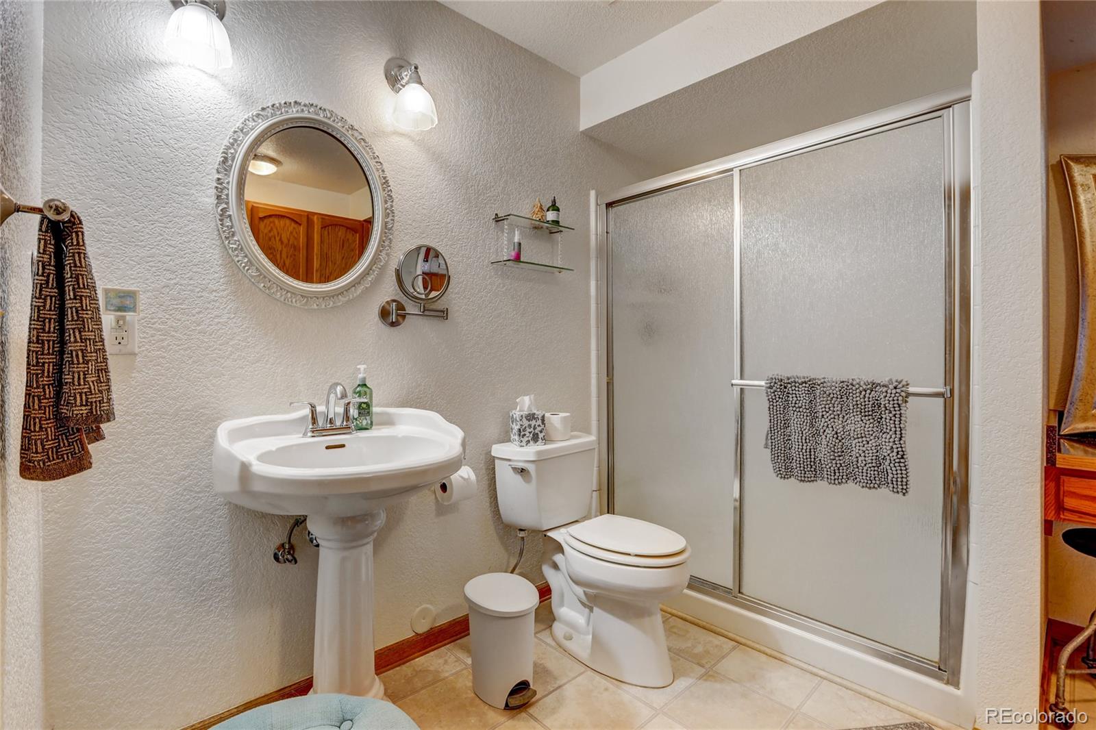 25 Granada Way Pine, CO 80470 - Photo 9 of 40 a bathroom with a sink and a mirror