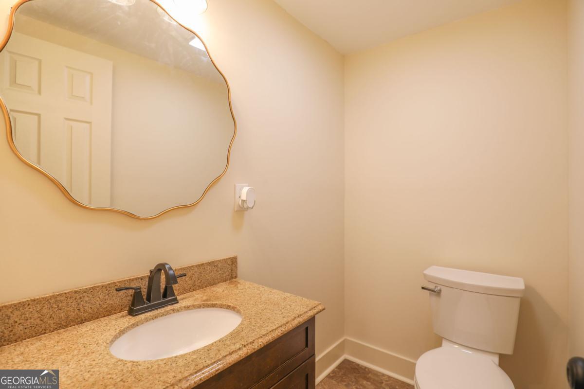 127 Fourth Street Southwest Milledgeville, GA 31061 - Photo 11 of 28 a bathroom with a sink and a mirror