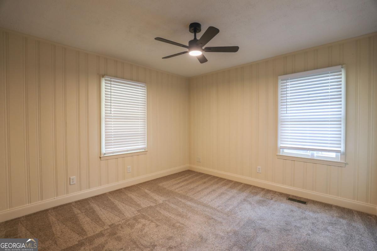 127 Fourth Street Southwest Milledgeville, GA 31061 - Photo 18 of 28 a view of an empty room with a window