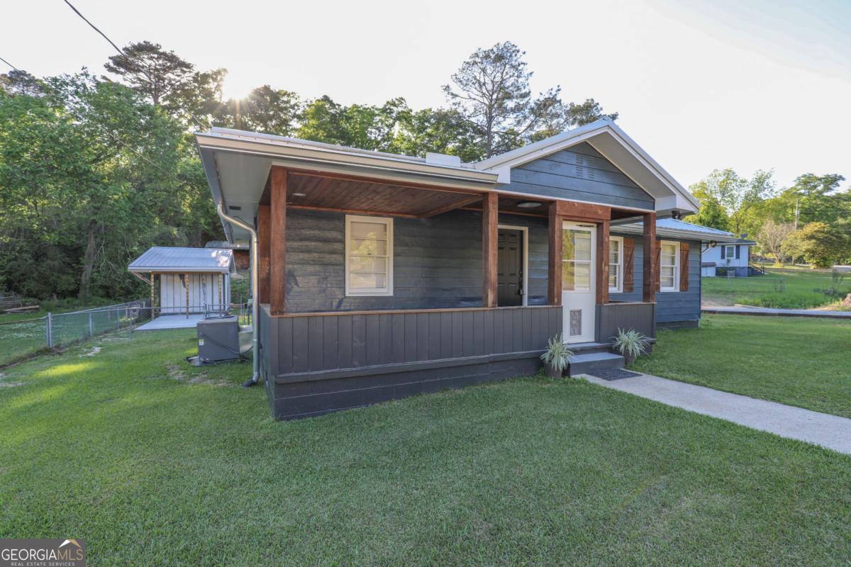 127 Fourth Street Southwest Milledgeville, GA 31061 - Photo 2 of 28 a view of a house with a yard