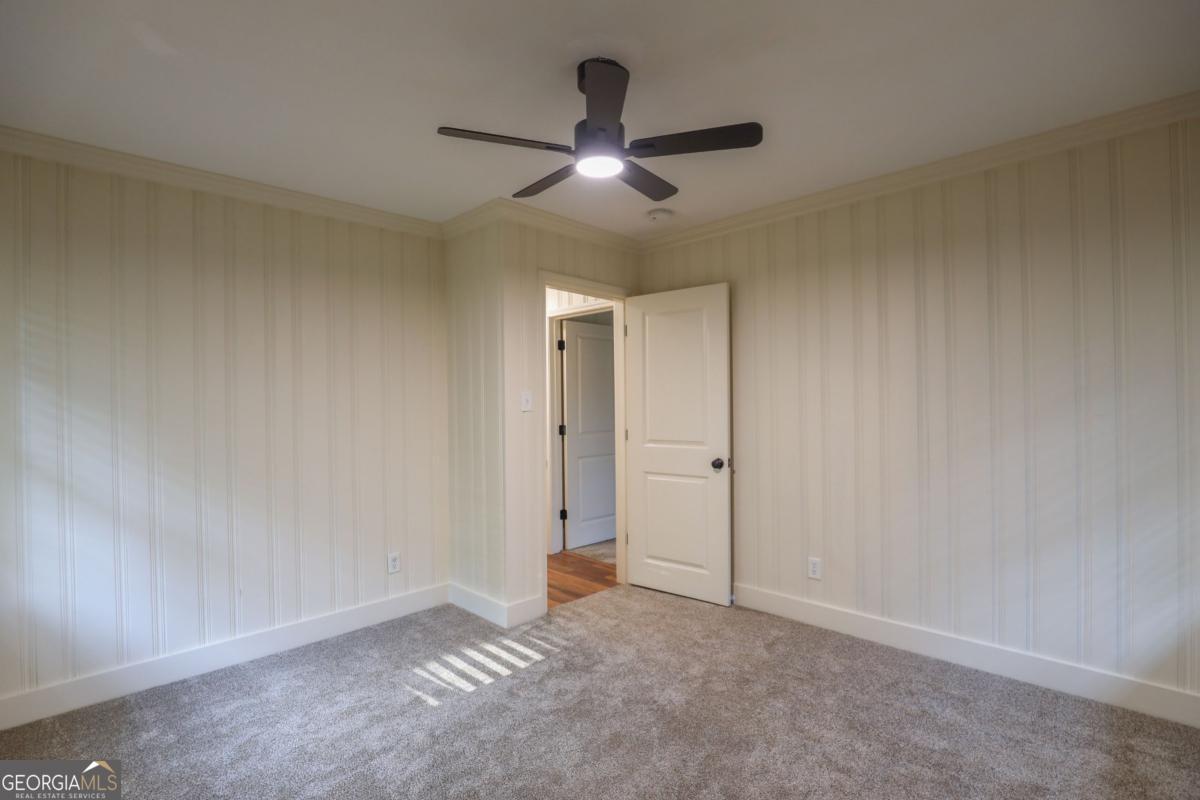 127 Fourth Street Southwest Milledgeville, GA 31061 - Photo 21 of 28 wooden floor in an empty room