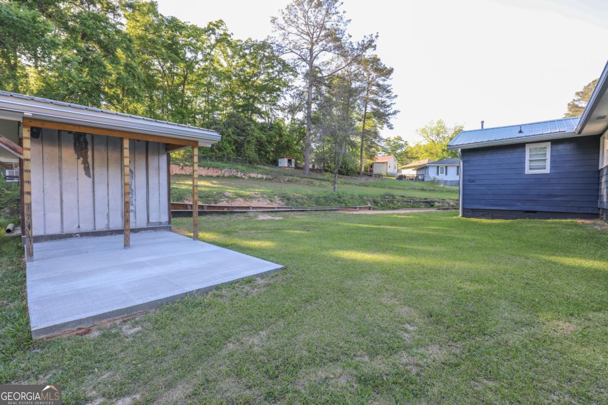 127 Fourth Street Southwest Milledgeville, GA 31061 - Photo 23 of 28 a view of backyard of house with green space
