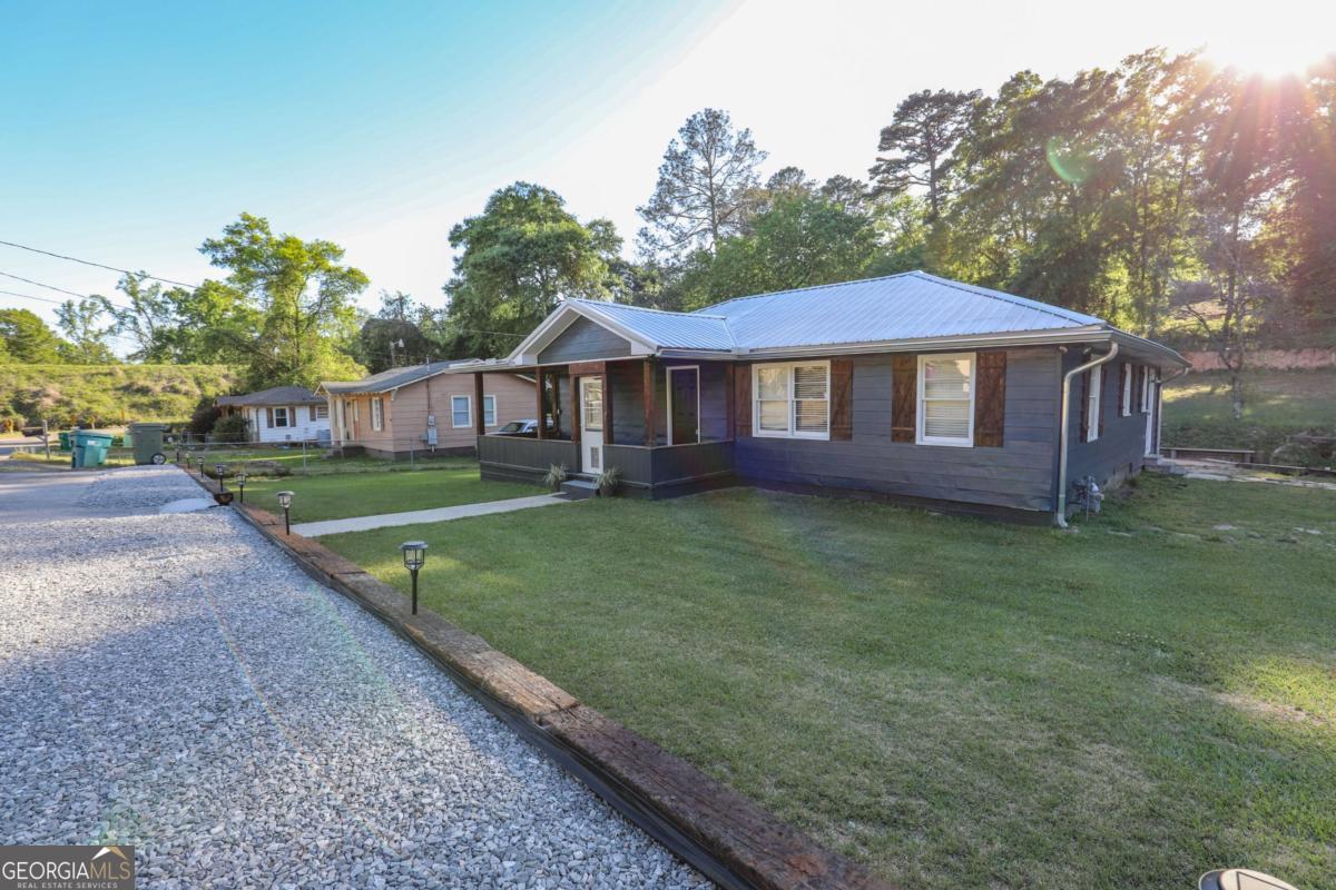 127 Fourth Street Southwest Milledgeville, GA 31061 - Photo 28 of 28 a view of a house with a yard