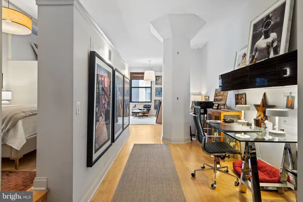 a view of a living room with furniture and a flat screen tv