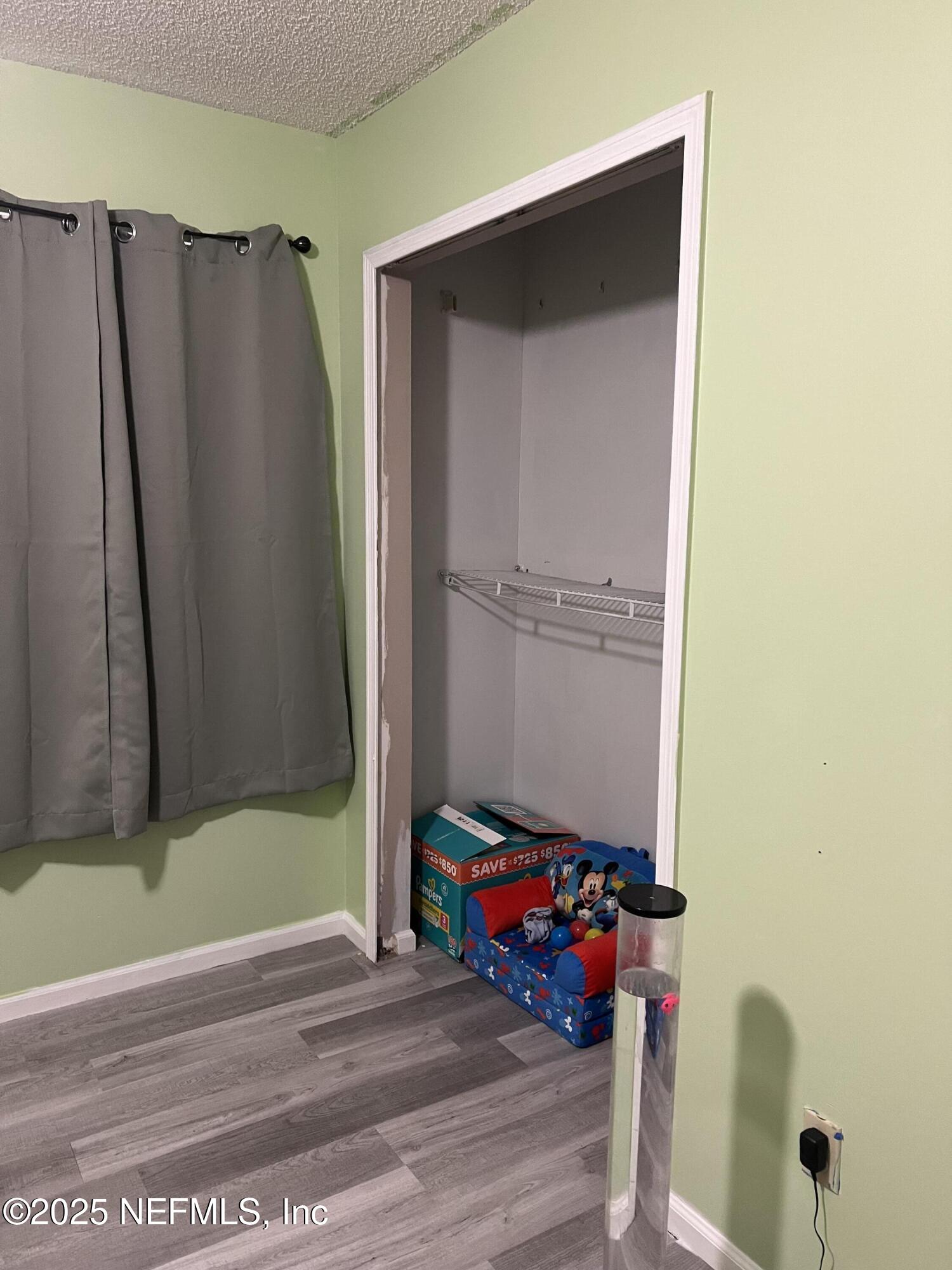 957 Aries Road West Jacksonville, FL 32216 - Photo 16 of 28 a view of walk in closet with clothes and shoes