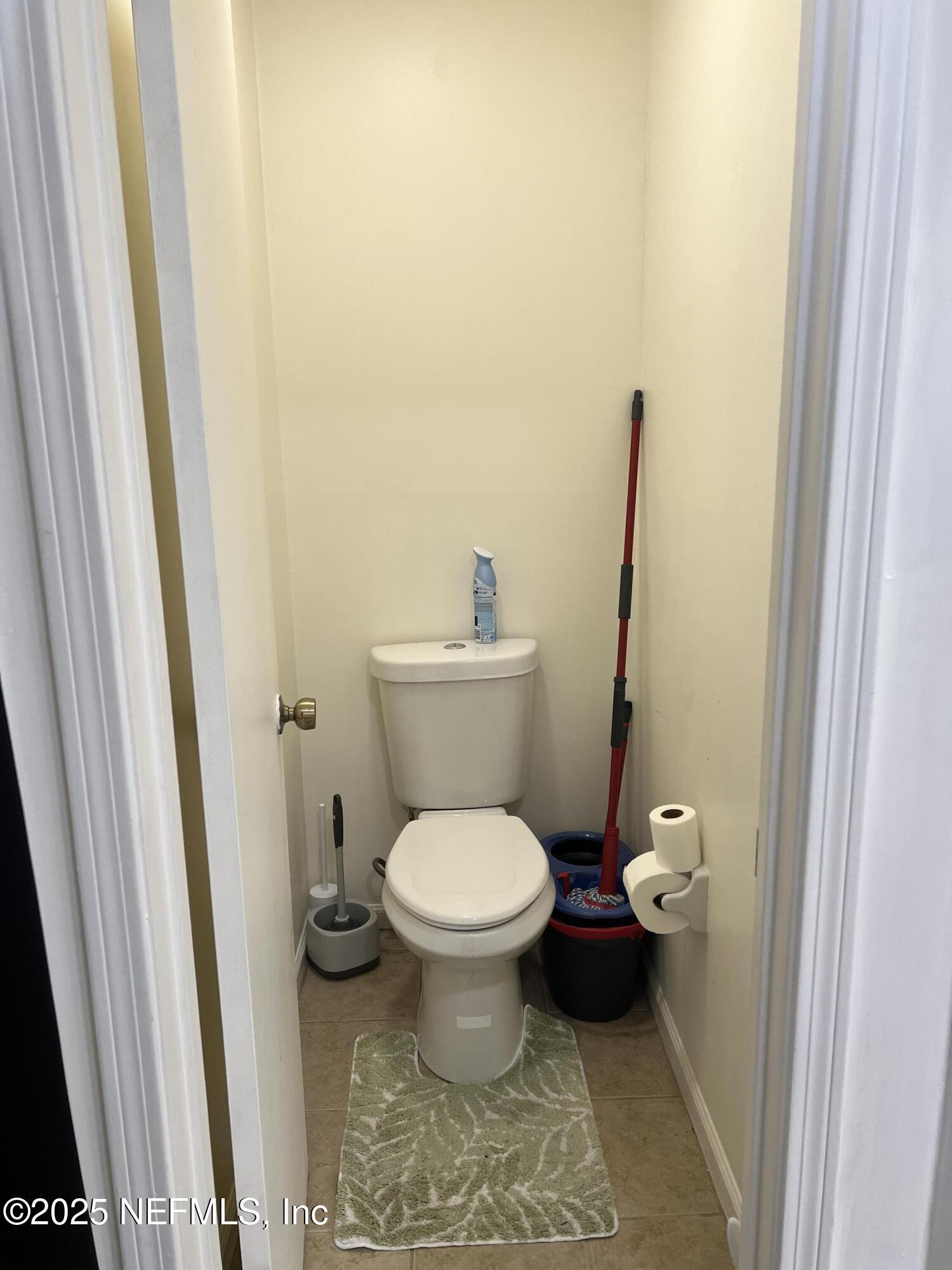 957 Aries Road West Jacksonville, FL 32216 - Photo 20 of 28 a white toilet sitting next to a sink