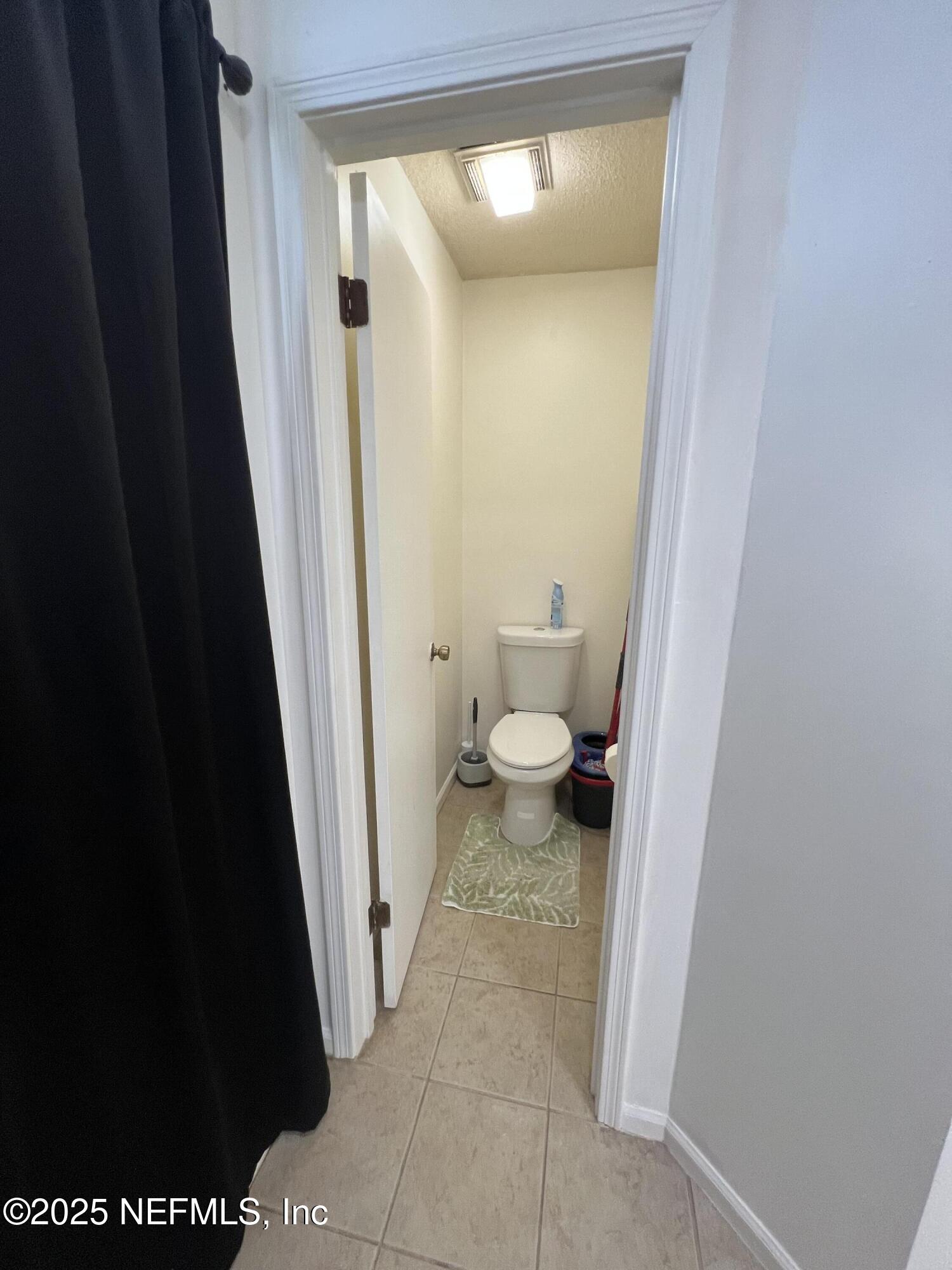 957 Aries Road West Jacksonville, FL 32216 - Photo 21 of 28 a bathroom with a sink and a toilet