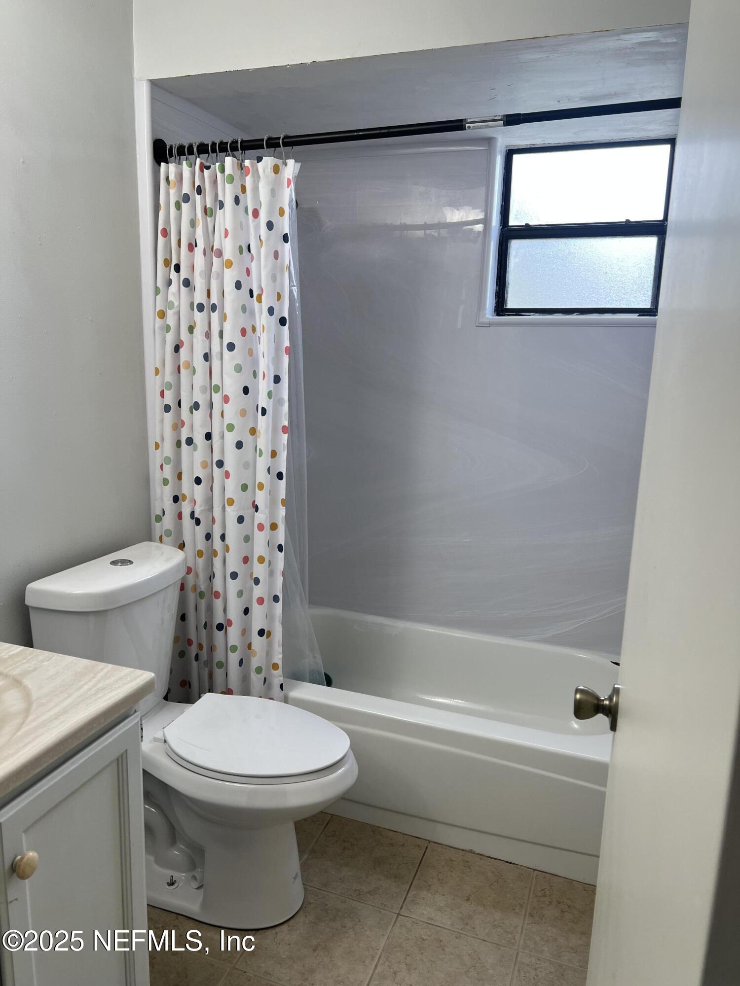 957 Aries Road West Jacksonville, FL 32216 - Photo 27 of 28 a bathroom with a toilet and a shower