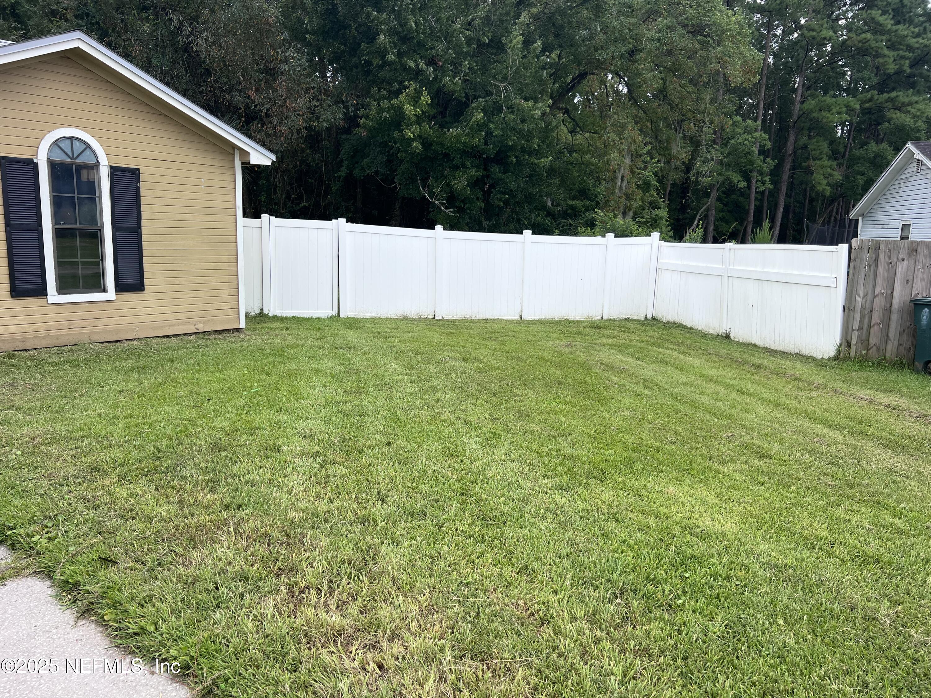 957 Aries Road West Jacksonville, FL 32216 - Photo 7 of 28 a view of a backyard