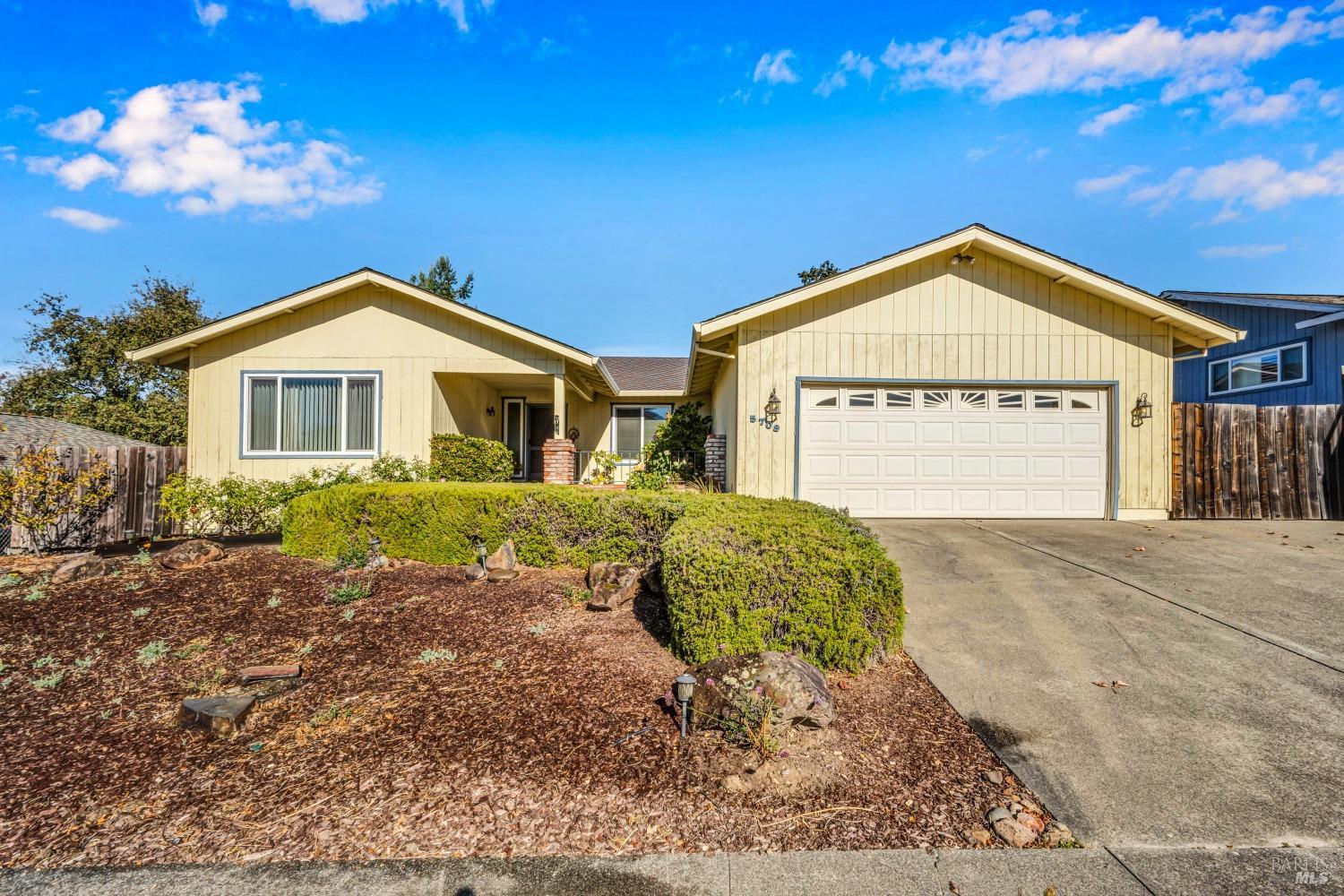 5709 Reynaud Court Santa Rosa, CA 95409 - Photo 1 of 1 a front view of a house with a yard