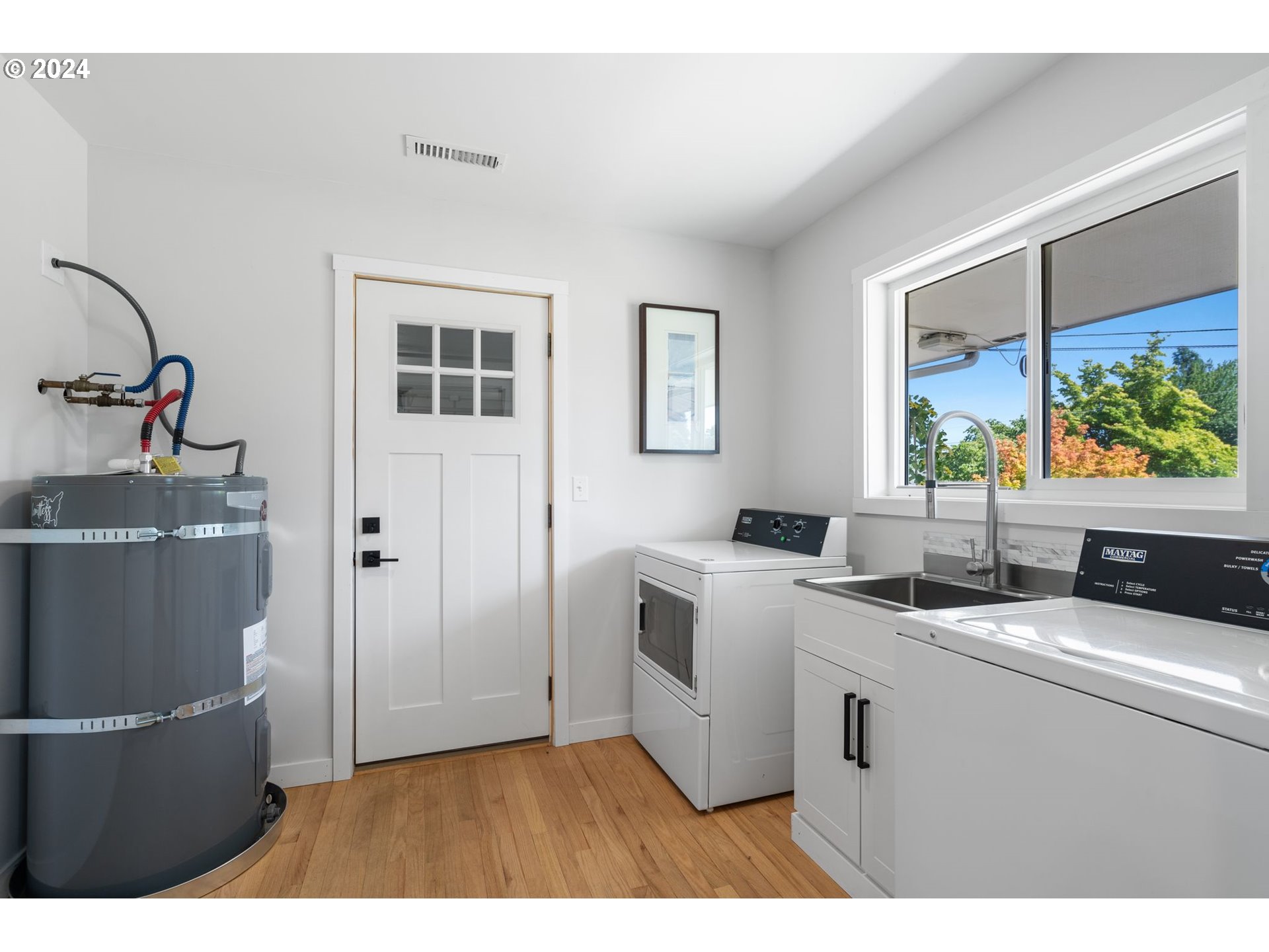 1617 Northeast Ione Loop Camas, WA 98607 - Photo 12 of 15 a kitchen with a sink and a refrigerator