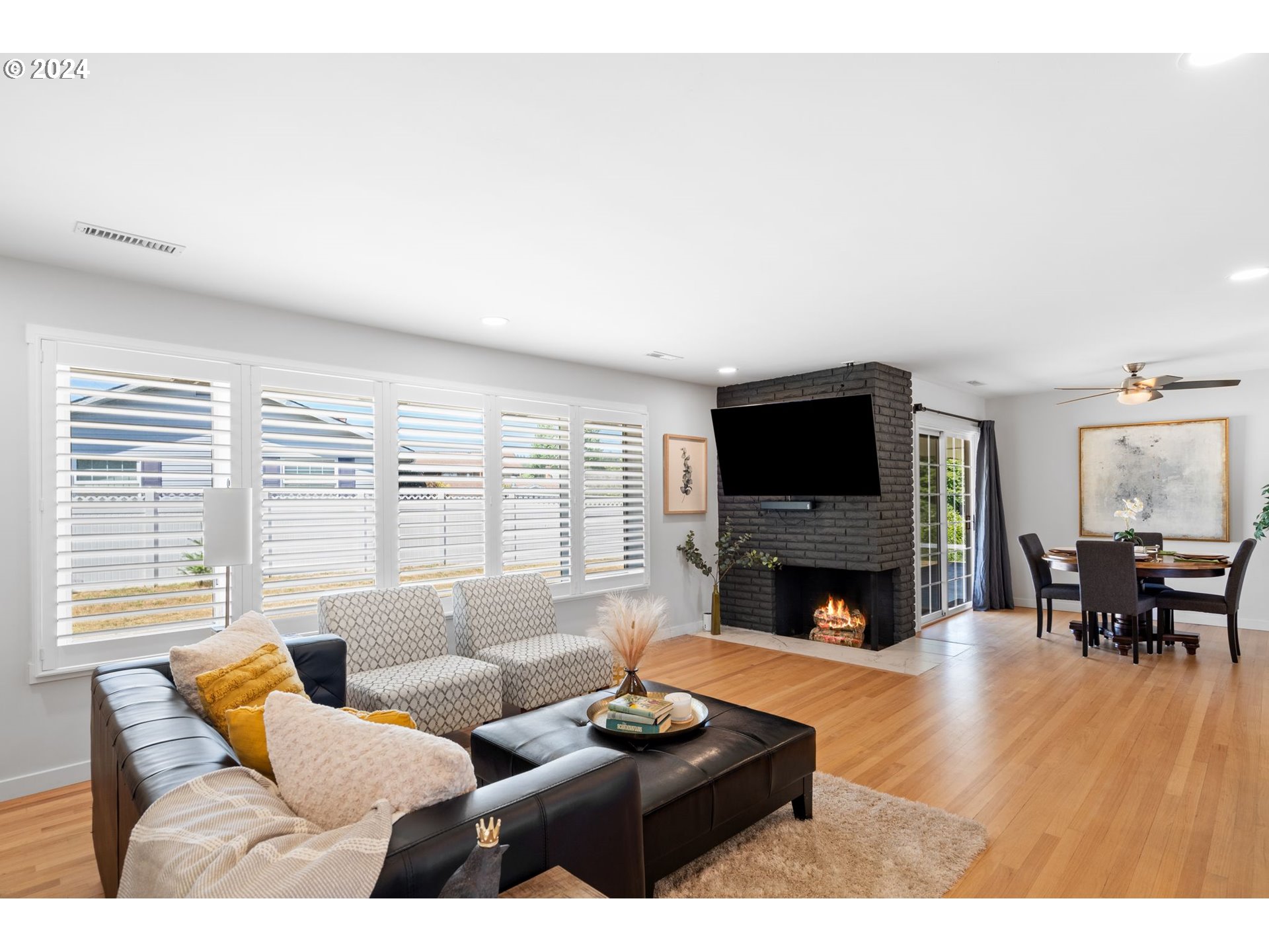 1617 Northeast Ione Loop Camas, WA 98607 - Photo 6 of 15 a living room with furniture a fireplace and a flat screen tv