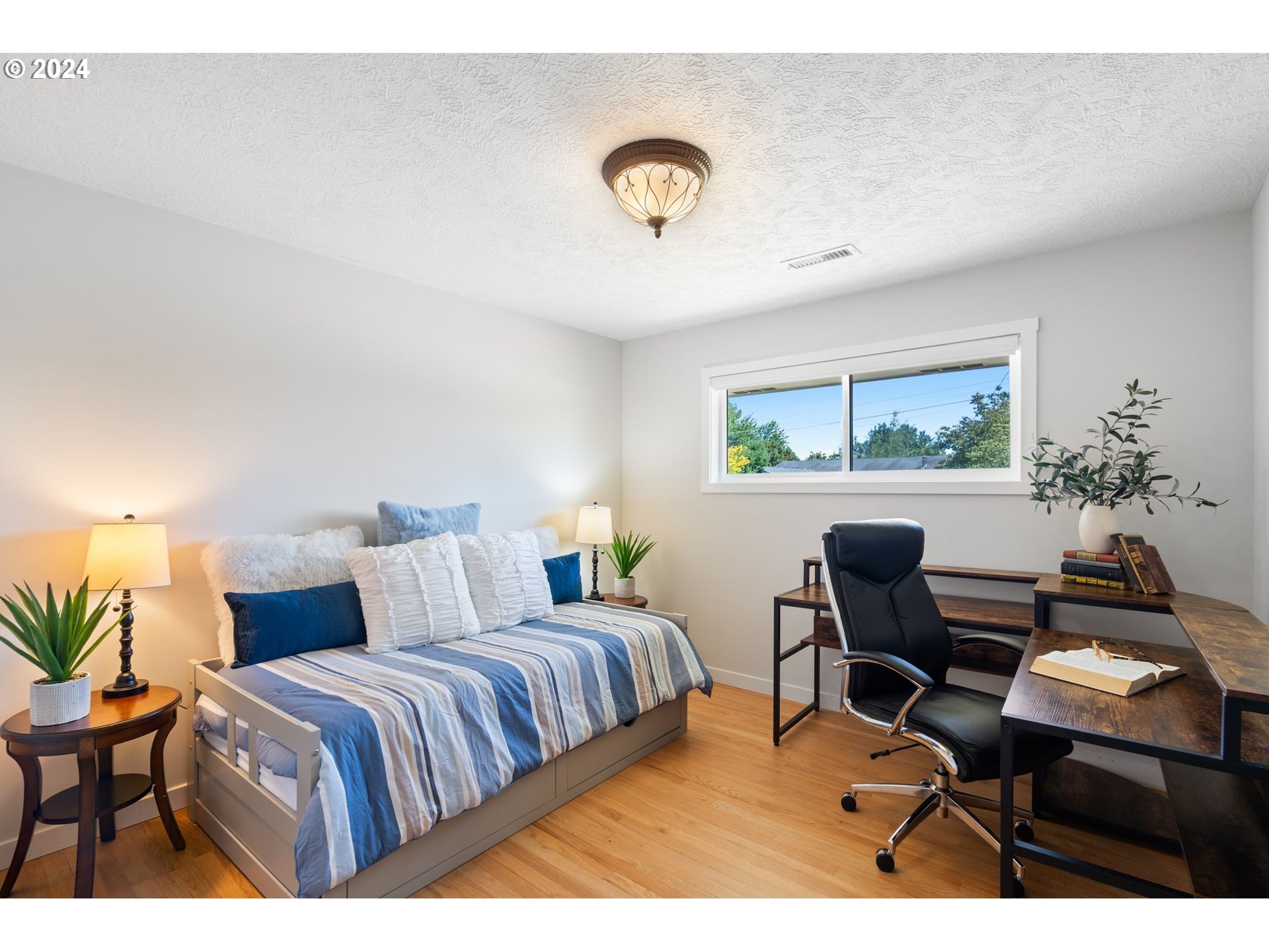 1617 Northeast Ione Loop Camas, WA 98607 - Photo 8 of 15 a bedroom with a bed a desk and chair