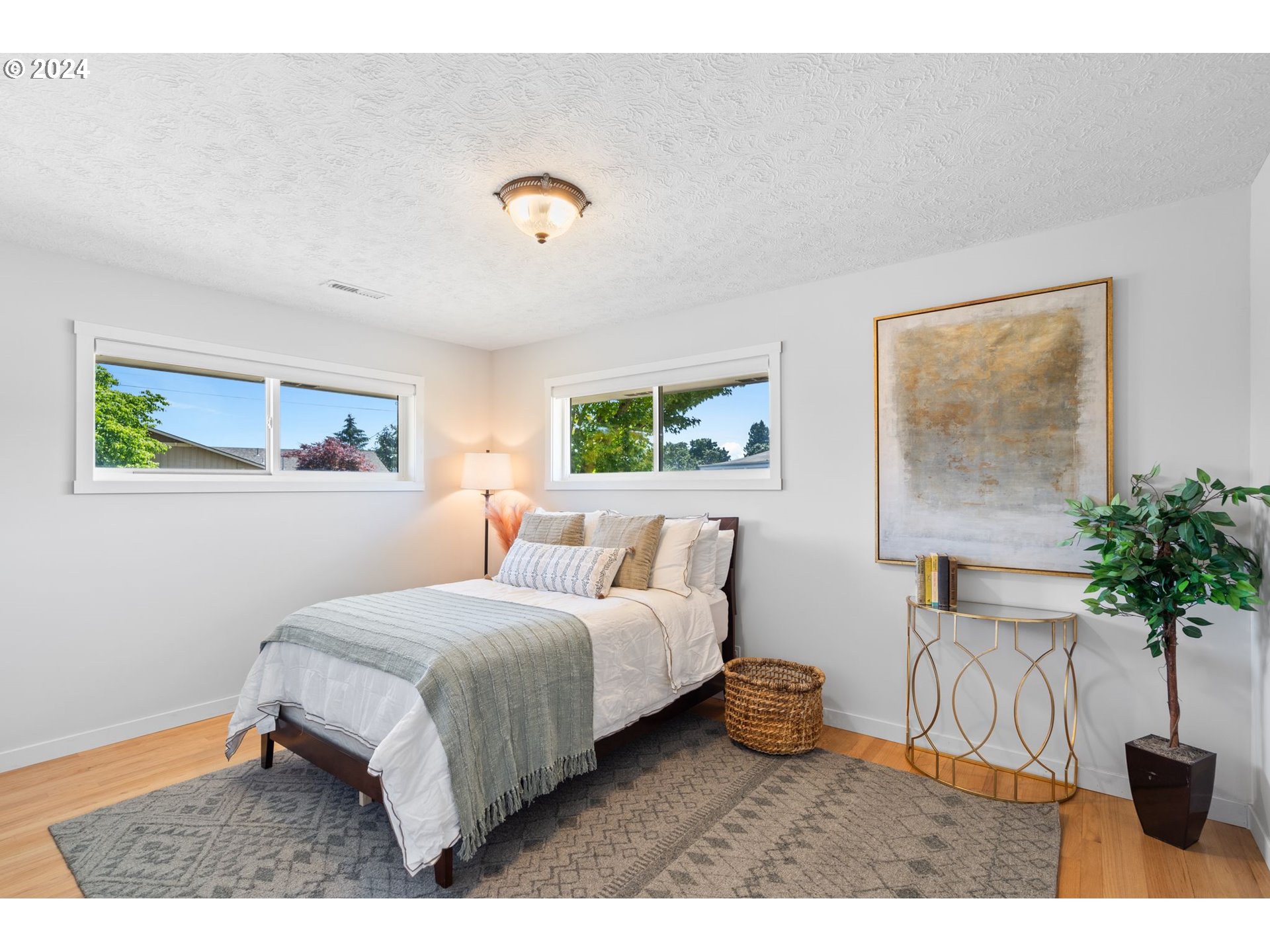 1617 Northeast Ione Loop Camas, WA 98607 - Photo 9 of 15 a bedroom with a bed and a potted plant