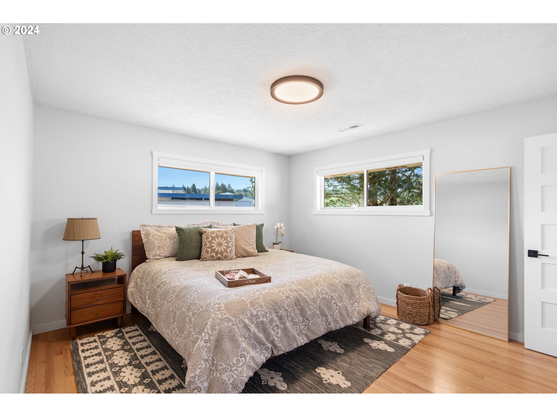 1617 Northeast Ione Loop Camas, WA 98607 - Photo 10 of 15 a bedroom with a bed and a night stand