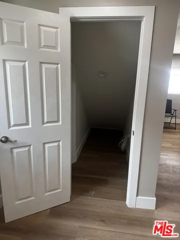a view of an entryway with wooden floor