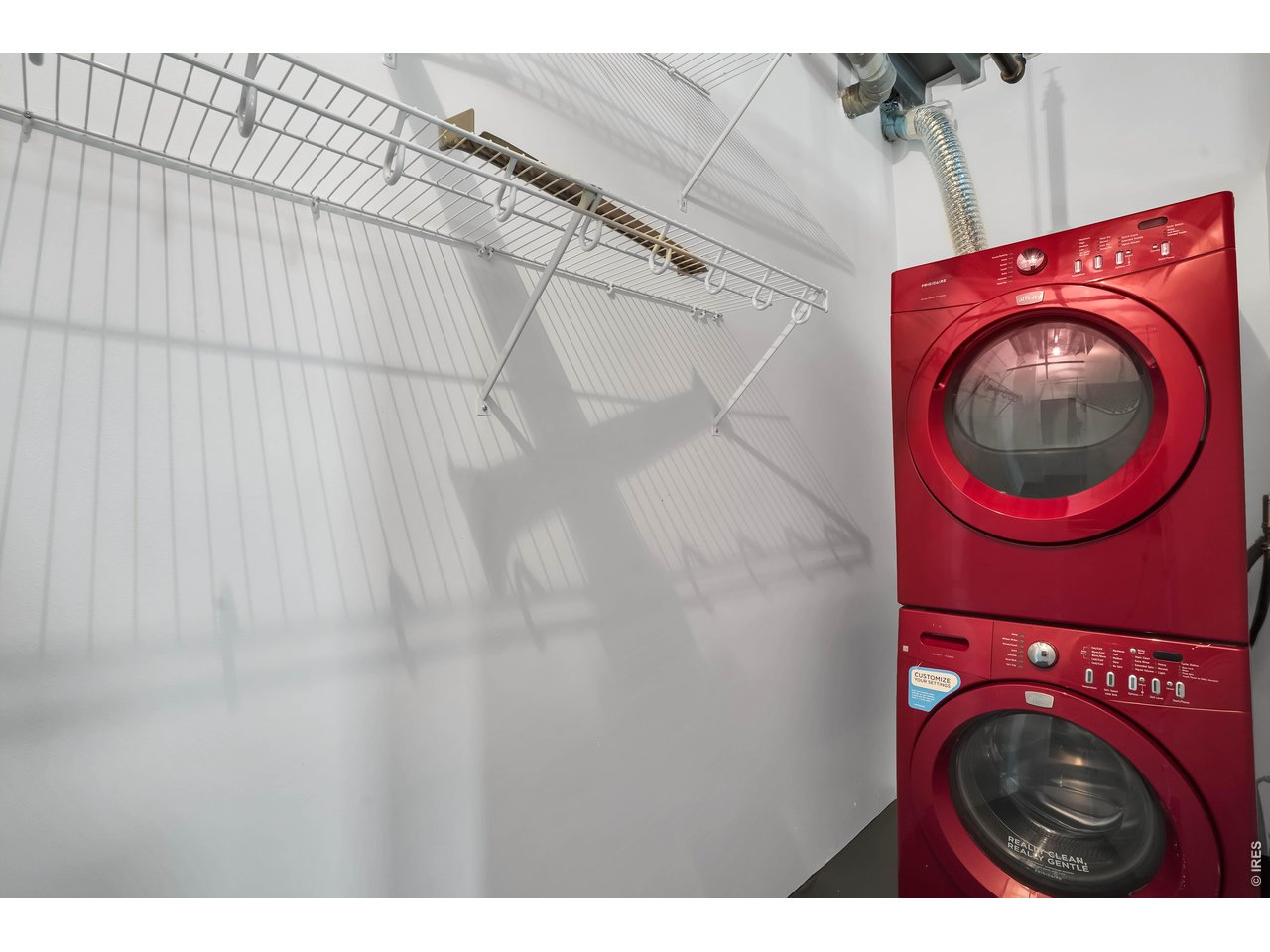 3457 Ringsby Court, Unit 327 Denver, CO 80216 - Photo 24 of 29 a utility room with dryer and washer